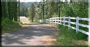 vinyl 3 rail along a driveway installed by valley fence