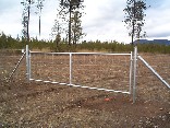 12 foot drive custom galvanized gate with field fence on it