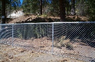 5 foot galvanized chain link fence with 1 5/8 top rail and steel fittings at a pizza place in the Spokane Valley, Washington