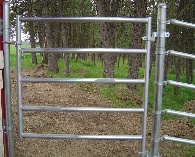 5 Rail Galvanized Post and Rail Man Gate to Match Fence, with closure post anchored to barn