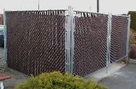 Dark brown slats to help hide a Garbage Dumpster.